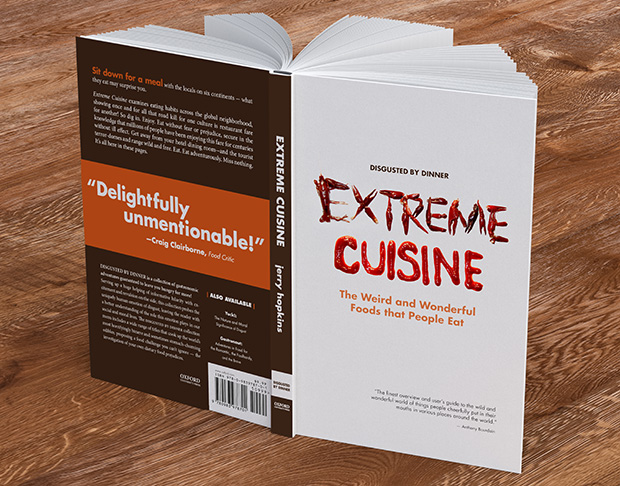 Book titled 'Extreme Cuisine'. The title treatment of the book consists of crawfish legs making the word 'Extreme' with 'Cuisine' written in hot sauce.